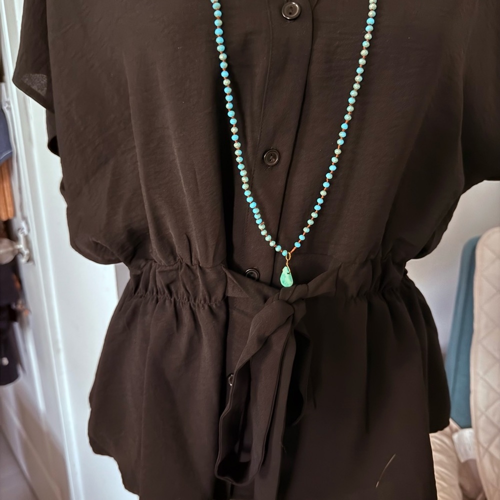 This is like new black top with a tie waist and buttons. - Picture 4 of 4